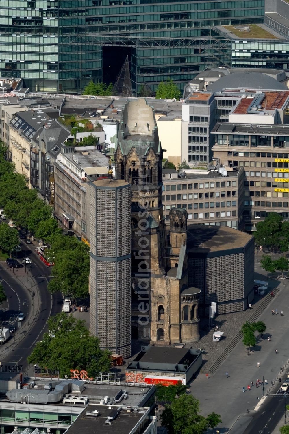 Berlin from above - The Protestant Kaiser William Memorial Church, commonly short memorial church stands on the Breitscheidplatz between the Kurfuerstendamm, the Tauentzienstrasse and the Budapest street in Berlin's Charlottenburg district. The non-damaged part of the old church is now a museum and war memorial