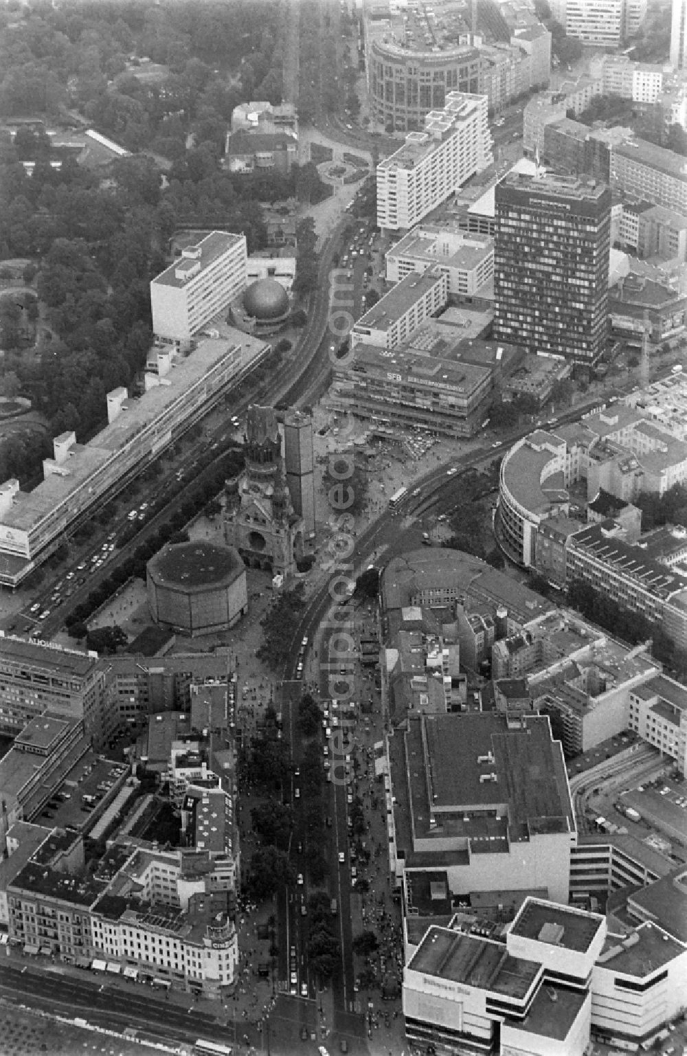 Aerial image Berlin - The Protestant Kaiser William Memorial Church (colloquially known Memorial Church and in Berlin dialect called Hollow Tooth) is located at Breitscheidplatz between the Kurfuerstendamm, the Tauentzienstrasse and the Budapest street in Berlin's Charlottenburg district