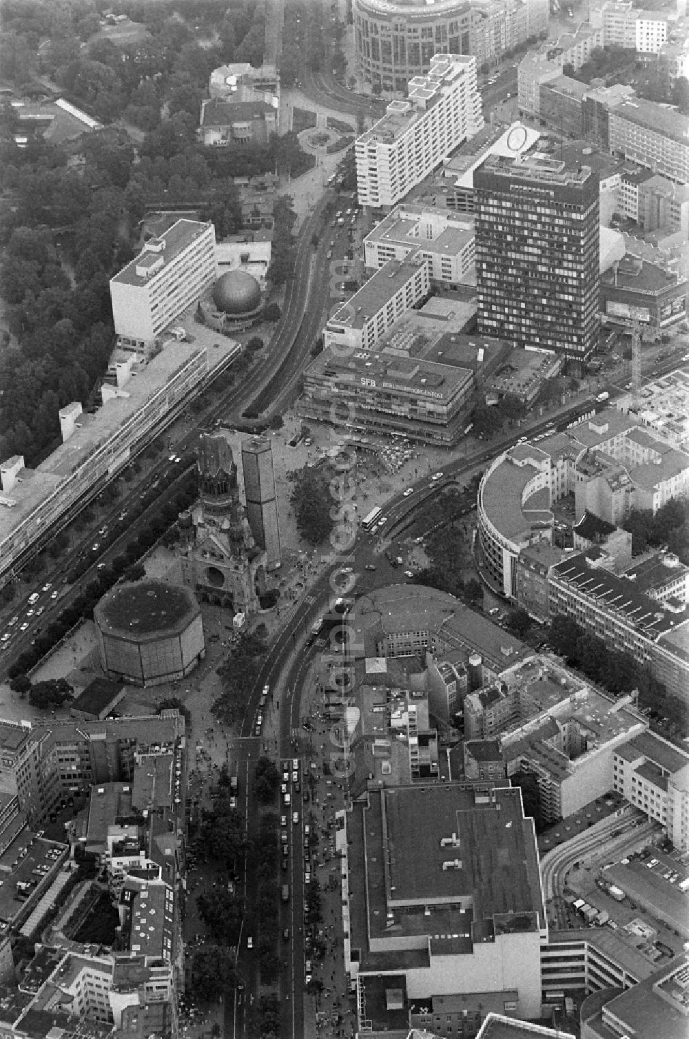 Berlin from above - The Protestant Kaiser William Memorial Church (colloquially known Memorial Church and in Berlin dialect called Hollow Tooth) is located at Breitscheidplatz between the Kurfuerstendamm, the Tauentzienstrasse and the Budapest street in Berlin's Charlottenburg district