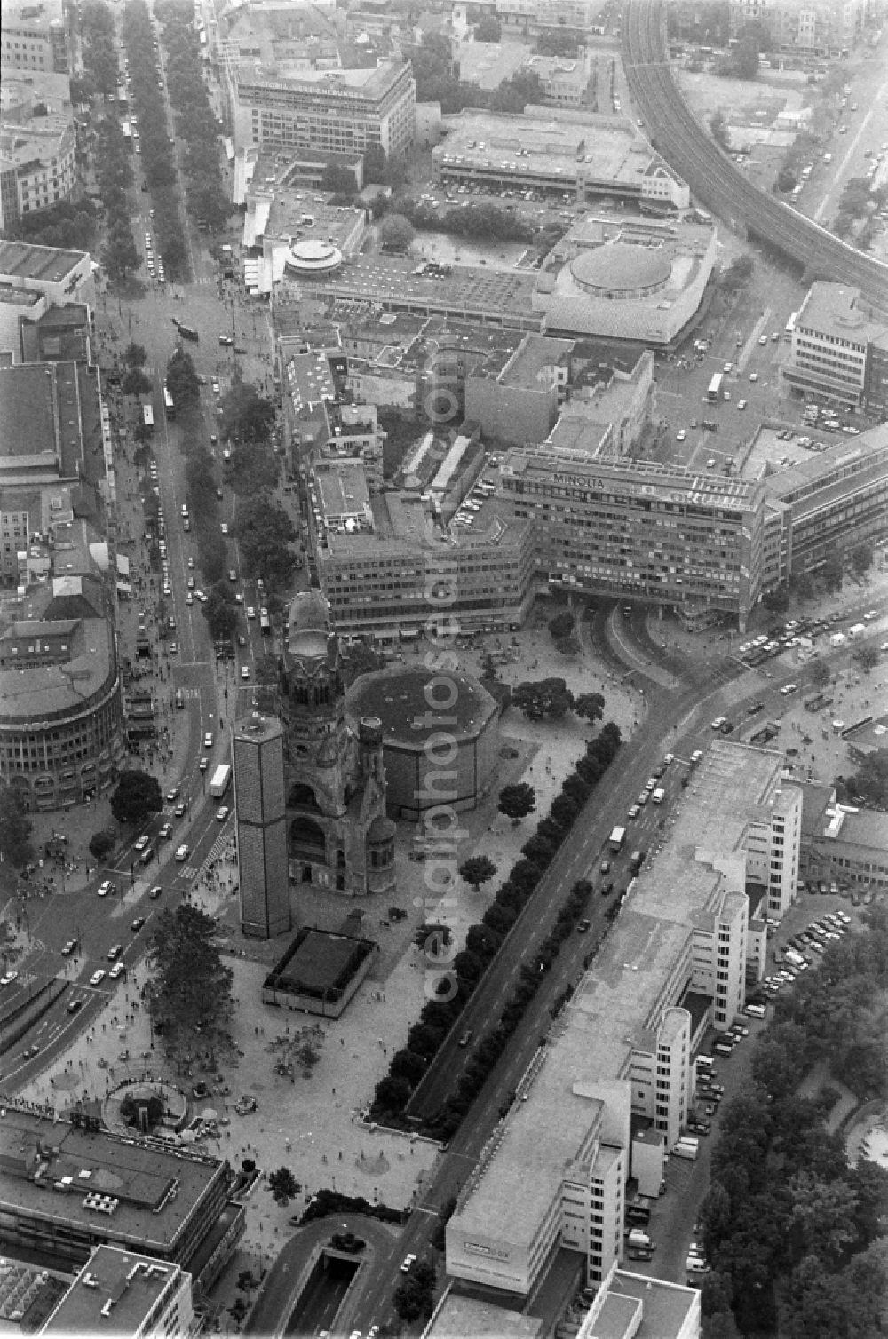 Berlin from the bird's eye view: The Protestant Kaiser William Memorial Church (colloquially known Memorial Church and in Berlin dialect called Hollow Tooth) is located at Breitscheidplatz between the Kurfuerstendamm, the Tauentzienstrasse and the Budapest street in Berlin's Charlottenburg district