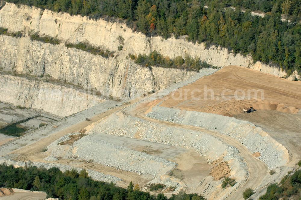 Rüdersdorf from above - Blick auf den Kalksteinbruch Rüdersdorf östlich von Berlin, auf dem südlichen Barnim gelegen, er ist der größte geologische Aufschluss in Norddeutschland aus dem Erdmittelalter, entstanden durch Kalkabbau, bestehend aus einem Museumspark Baustoffindustrie Rüdersdorf und dem eigentlichen Kalksteinbruch.