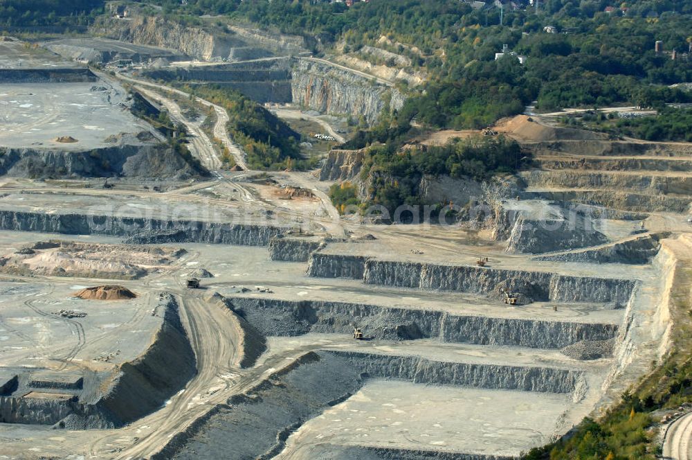 Rüdersdorf from the bird's eye view: Blick auf den Kalksteinbruch Rüdersdorf östlich von Berlin, auf dem südlichen Barnim gelegen, er ist der größte geologische Aufschluss in Norddeutschland aus dem Erdmittelalter, entstanden durch Kalkabbau, bestehend aus einem Museumspark Baustoffindustrie Rüdersdorf und dem eigentlichen Kalksteinbruch.