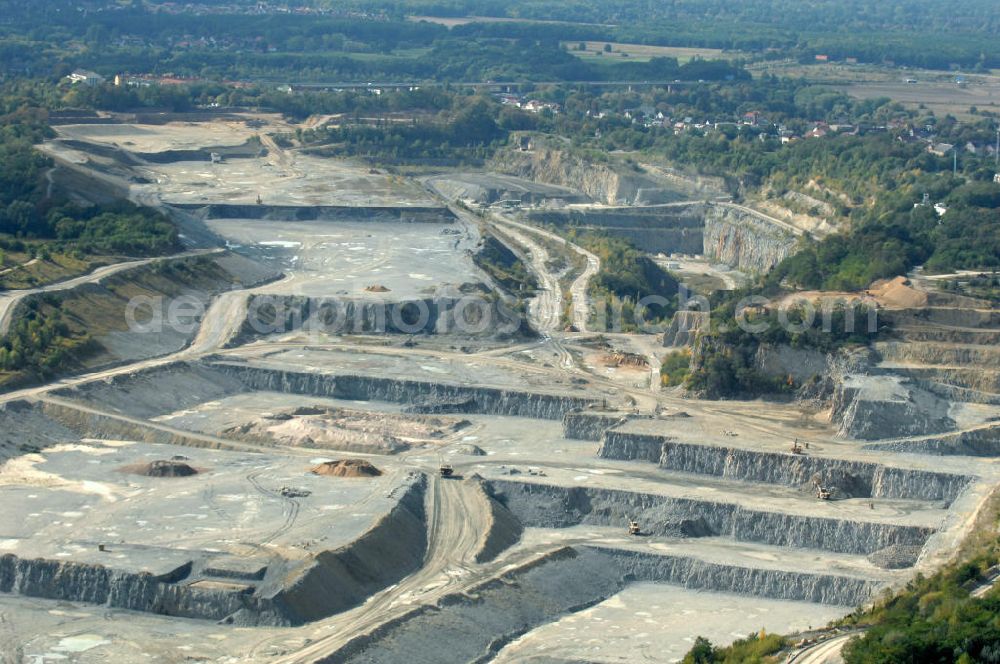 Aerial photograph Rüdersdorf - Blick auf den Kalksteinbruch Rüdersdorf östlich von Berlin, auf dem südlichen Barnim gelegen, er ist der größte geologische Aufschluss in Norddeutschland aus dem Erdmittelalter, entstanden durch Kalkabbau, bestehend aus einem Museumspark Baustoffindustrie Rüdersdorf und dem eigentlichen Kalksteinbruch.