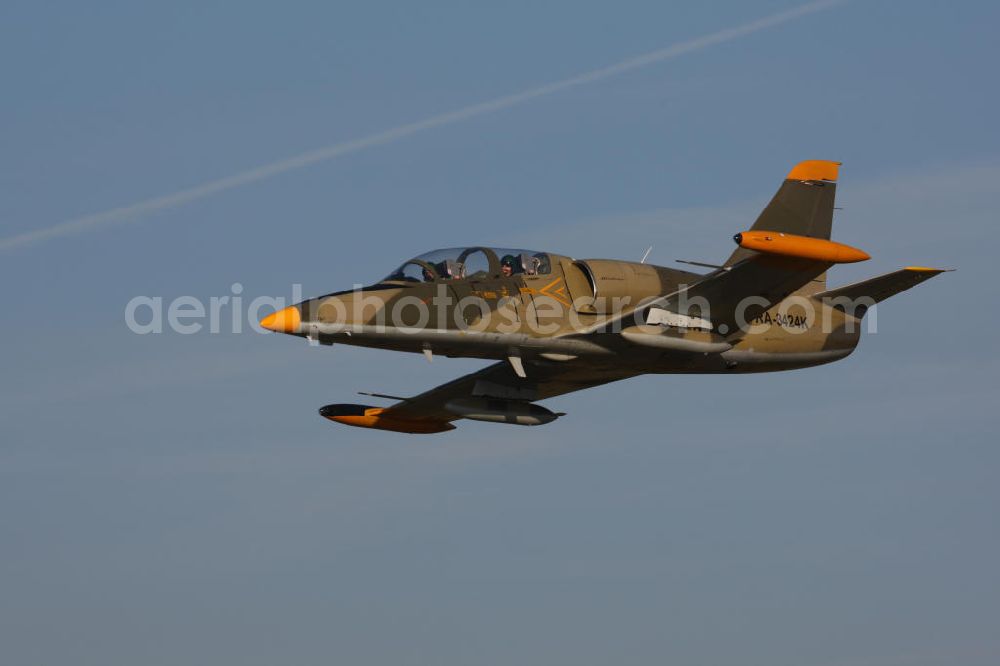 Aerial photograph Bitburg - Kampfjet Aero L-39 Albatros auf dem Flugplatz Bitburg EDRB / Rheinland-Pfalz. Die L-39 war ursprünglich als einstrahliges Schulflugzeug der tschechischen Luftstreitkräfte entwickelt worden. Jet fighter Aero L-39 Albatros at the airfield Bitburg / Rhineland-Palatinate.