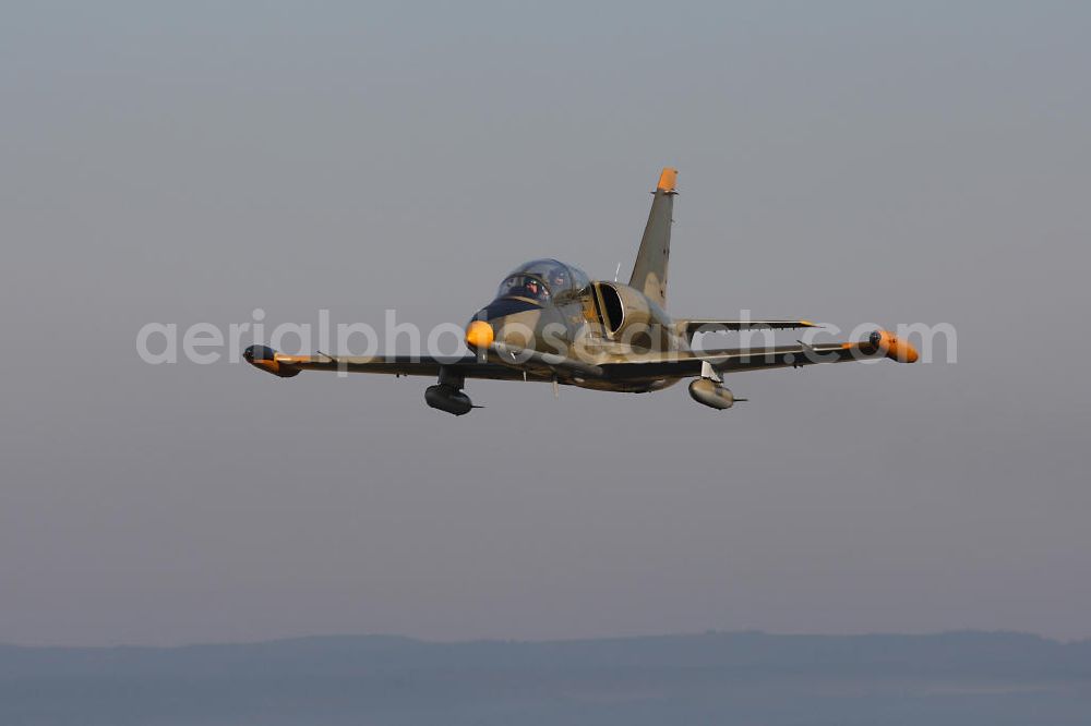 Aerial photograph Bitburg - Kampfjet Aero L-39 Albatros auf dem Flugplatz Bitburg EDRB / Rheinland-Pfalz. Die L-39 war ursprünglich als einstrahliges Schulflugzeug der tschechischen Luftstreitkräfte entwickelt worden. Jet fighter Aero L-39 Albatros at the airfield Bitburg / Rhineland-Palatinate.