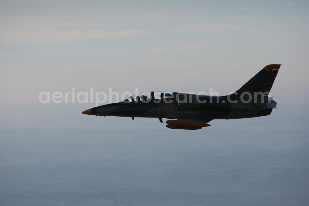 Aerial photograph Bitburg - Kampfjet Aero L-39 Albatros auf dem Flugplatz Bitburg EDRB / Rheinland-Pfalz. Die L-39 war ursprünglich als einstrahliges Schulflugzeug der tschechischen Luftstreitkräfte entwickelt worden. Jet fighter Aero L-39 Albatros at the airfield Bitburg / Rhineland-Palatinate.