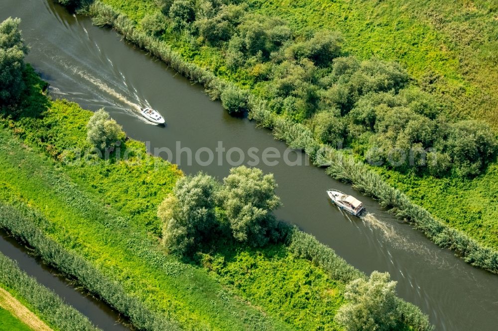 Malchin from above - Channel flow and river banks of the Peene - sewer with motorboats in Malchin in the state Mecklenburg - Western Pomerania