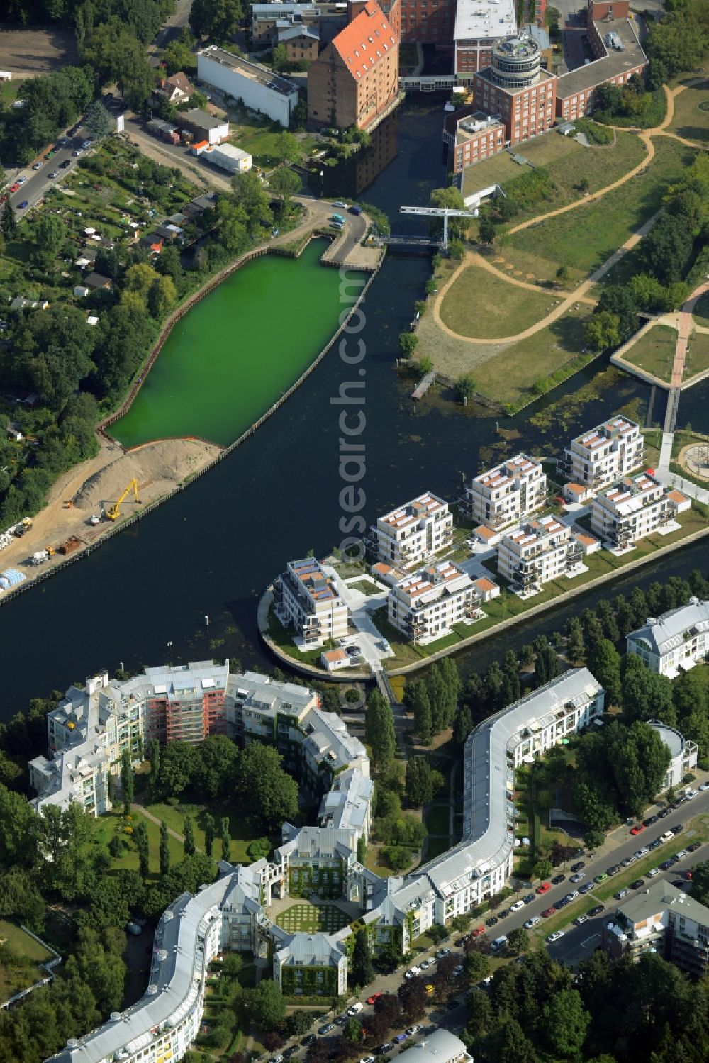 Aerial photograph Berlin - History channel and riparian areas with housing areas of the Tegeler Fliess at the Tegeler See in Reinickendorf in Berlin in Germany. Also shown the Tegeler Insel and the construction area at the Humboldtinsel