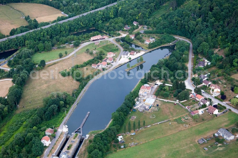 Aerial image Foug - Channel flow through tunnel and river banks of the waterway shipping Rhine to Marne channel in Foug in Grand Est, France