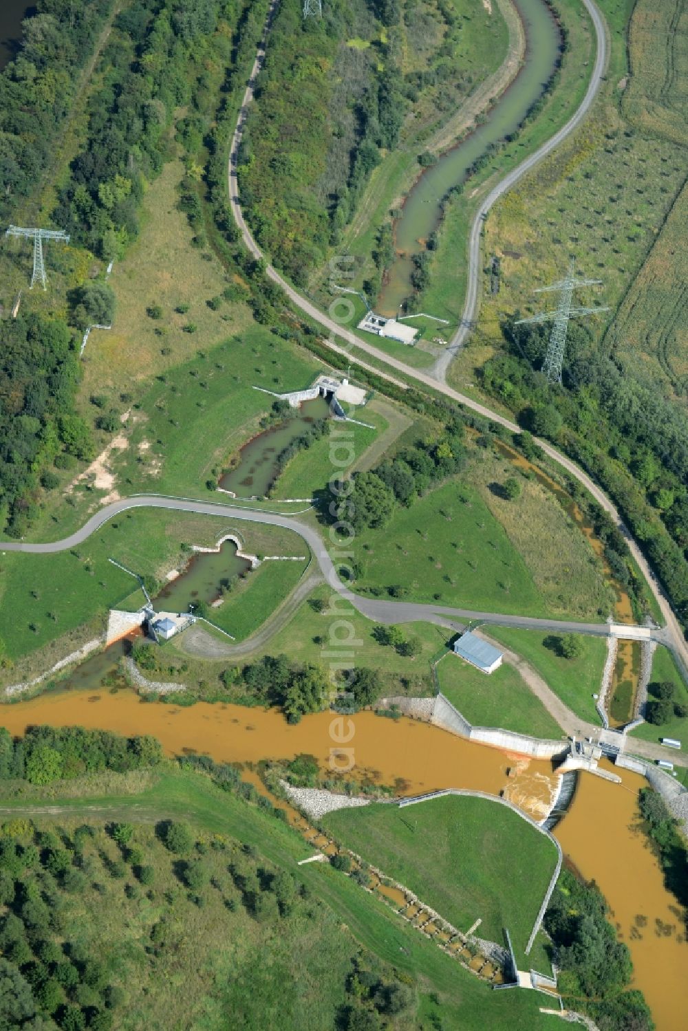 Böhlen from above - Channel and riparian areas of a canal connecting Lake Hainer See and the river Pleisse in Boehlen in the state of Saxony