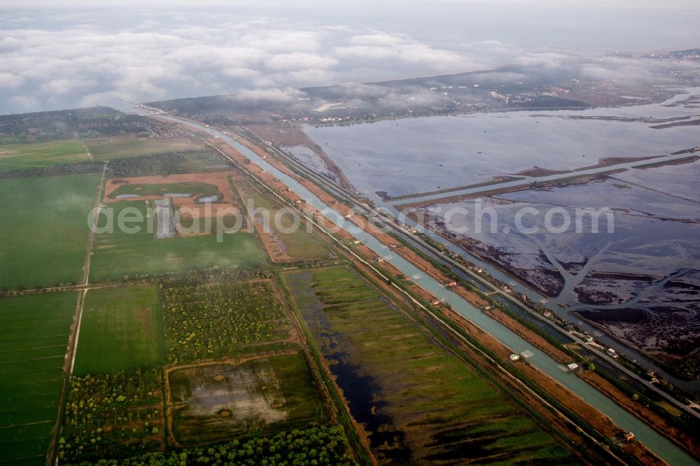 Aerial photograph Marina Romea - Channel flow and river banks of the waterway shipping Fiume Lamone in Marina Romea in Emilia-Romagna, Italy