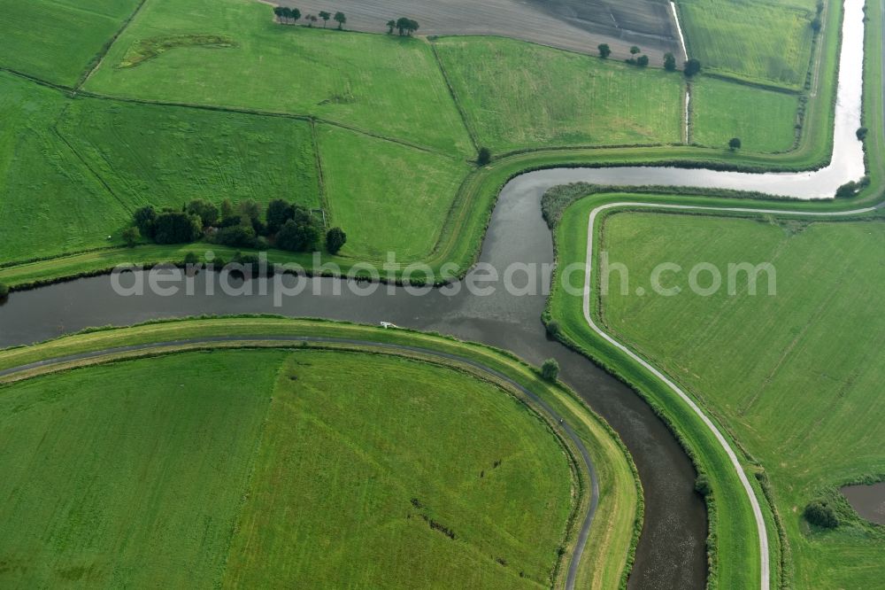 Aerial image Detern - Channel flow and river banks of the waterway shipping Nordloher-Barsseler Tief on corner to Dreyschloot- canal in Detern in the state Lower Saxony