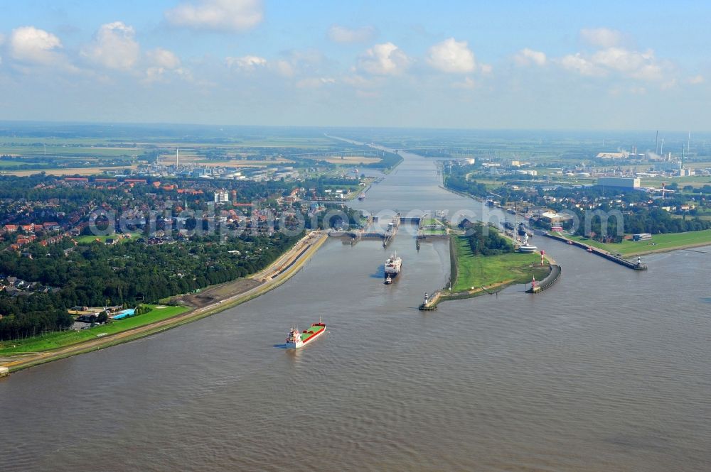 Brunsbüttel from above - Channel flow, river banks and water mouth of the waterway Nord-Ostseekanal in Brunsbuettel in the state Schleswig-Holstein