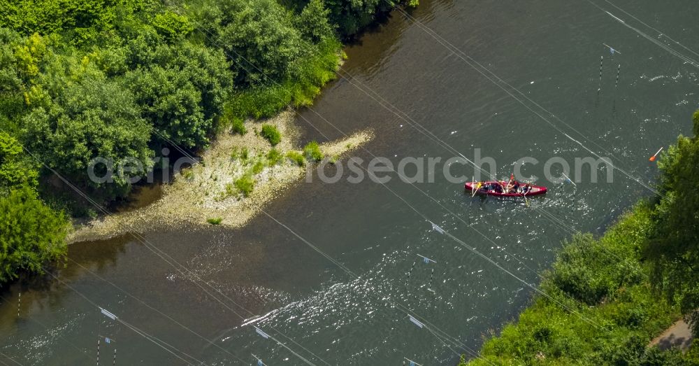 Aerial image Schwerte - Canoes on the river Ruhr in Schwerte in the state of North Rhine-Westphalia. The river is a beloved region for canoeing. The distinct red paddle boats of Lenne-Ruhr-Canoe-Tours are located on the water