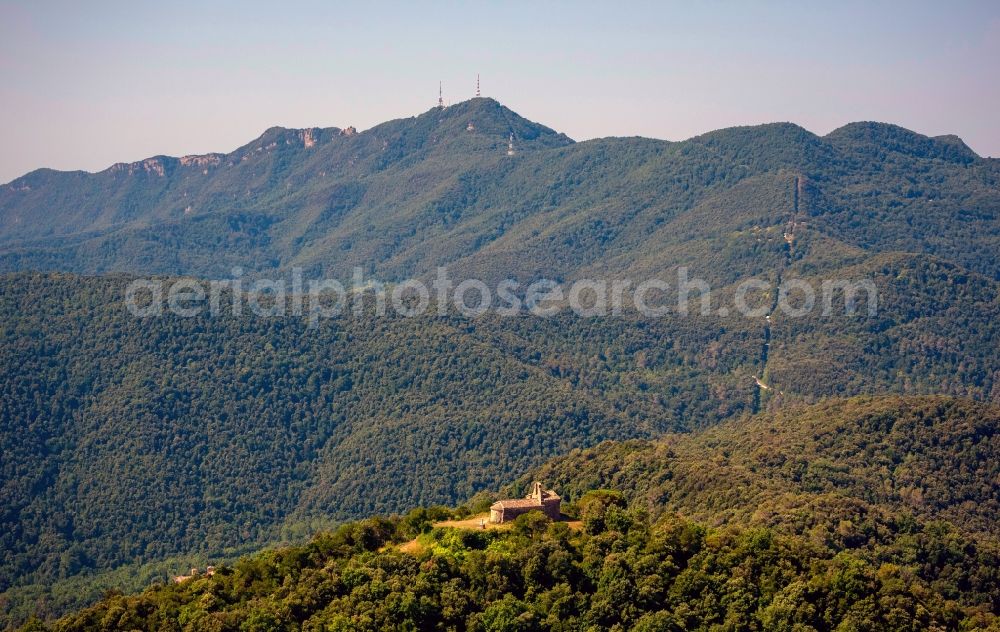 Pujarnol from above - View of an old chapel on a hill near the city Pujarnol in the province Catalonia in Spain