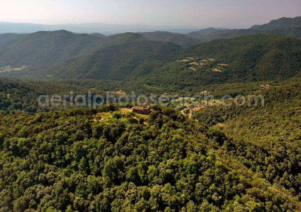 Pujarnol from the bird's eye view: View of an old chapel on a hill near the city Pujarnol in the province Catalonia in Spain