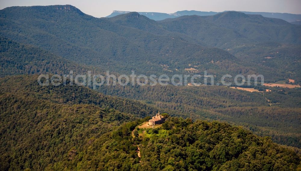 Aerial image Pujarnol - View of an old chapel on a hill near the city Pujarnol in the province Catalonia in Spain
