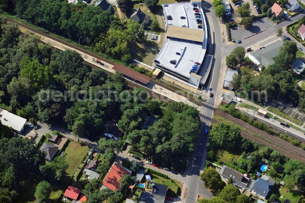 Aerial photograph Blankenfelde - Road layout of the Karl-Marx-Straße on the railway line Dresdner Bahn to the station Blankenfelde in Brandenburg. By the engineering community Dresdner Bahn is the new construction of a railway bridge as planned bridge construction