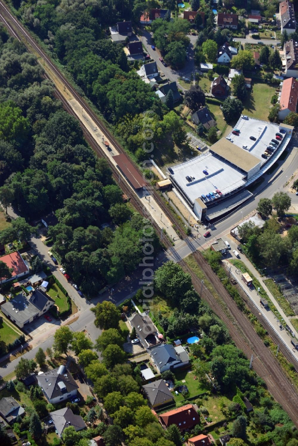 Blankenfelde from the bird's eye view: Road layout of the Karl-Marx-Straße on the railway line Dresdner Bahn to the station Blankenfelde in Brandenburg. By the engineering community Dresdner Bahn is the new construction of a railway bridge as planned bridge construction