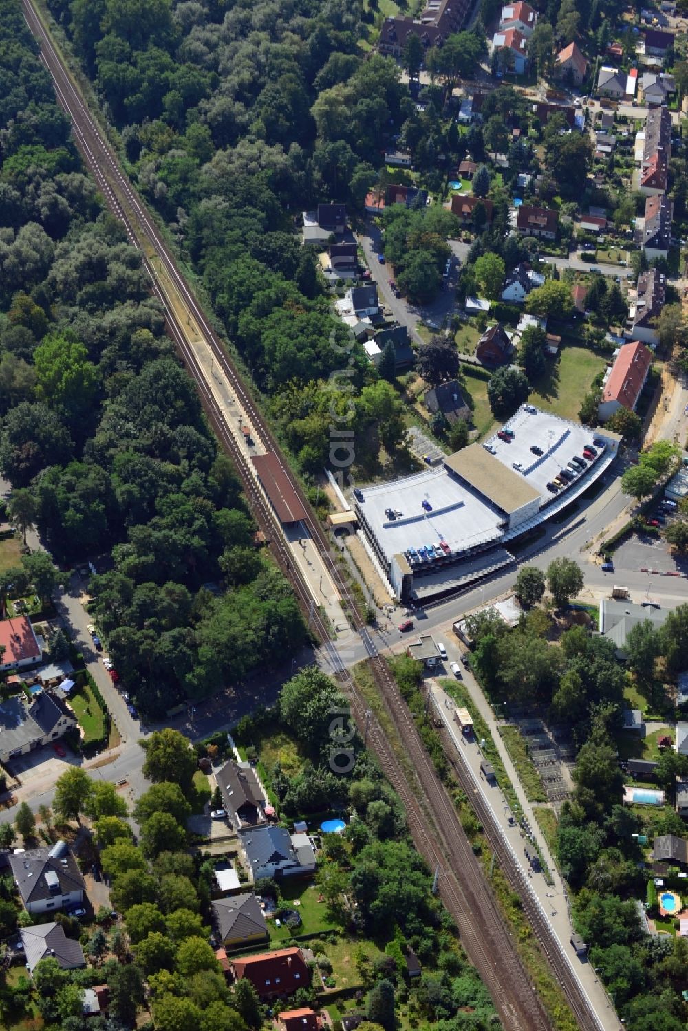 Aerial image Blankenfelde - Road layout of the Karl-Marx-Straße on the railway line Dresdner Bahn to the station Blankenfelde in Brandenburg. By the engineering community Dresdner Bahn is the new construction of a railway bridge as planned bridge construction