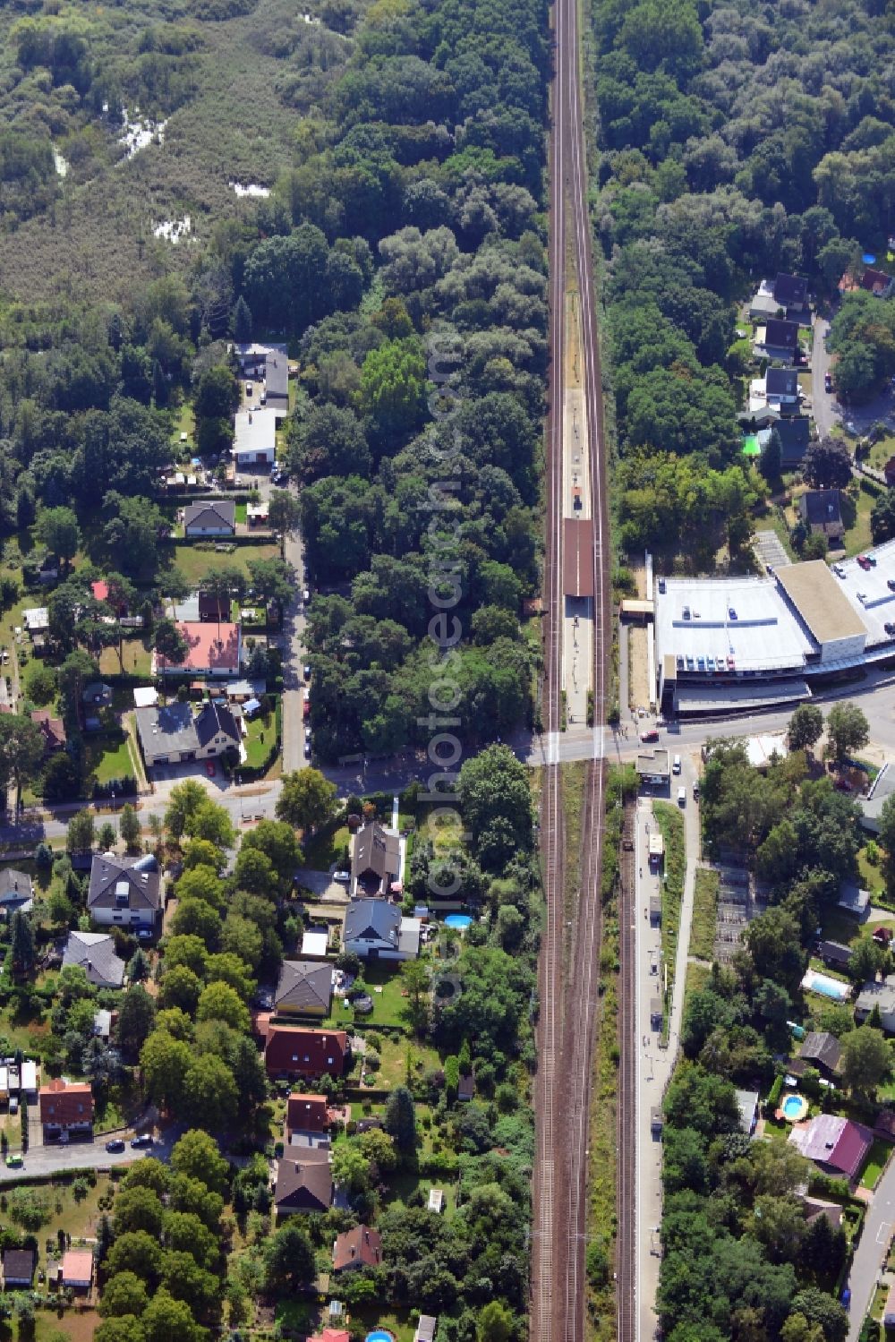 Blankenfelde from above - Road layout of the Karl-Marx-Straße on the railway line Dresdner Bahn to the station Blankenfelde in Brandenburg. By the engineering community Dresdner Bahn is the new construction of a railway bridge as planned bridge construction