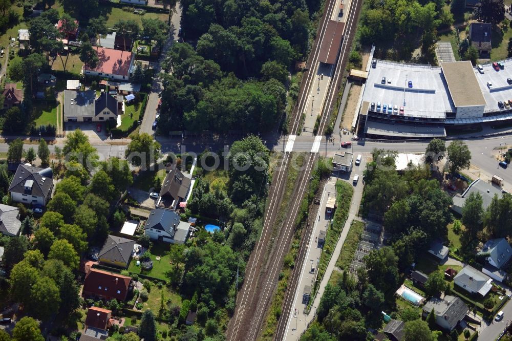 Blankenfelde from the bird's eye view: Road layout of the Karl-Marx-Straße on the railway line Dresdner Bahn to the station Blankenfelde in Brandenburg. By the engineering community Dresdner Bahn is the new construction of a railway bridge as planned bridge construction