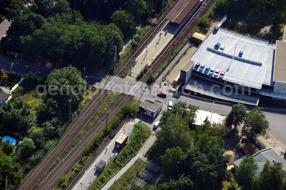 Aerial image Blankenfelde - Road layout of the Karl-Marx-Straße on the railway line Dresdner Bahn to the station Blankenfelde in Brandenburg. By the engineering community Dresdner Bahn is the new construction of a railway bridge as planned bridge construction