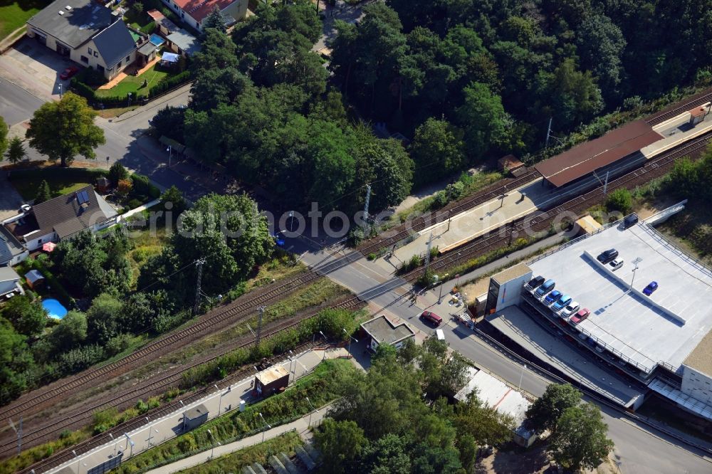 Blankenfelde from above - Road layout of the Karl-Marx-Straße on the railway line Dresdner Bahn to the station Blankenfelde in Brandenburg. By the engineering community Dresdner Bahn is the new construction of a railway bridge as planned bridge construction