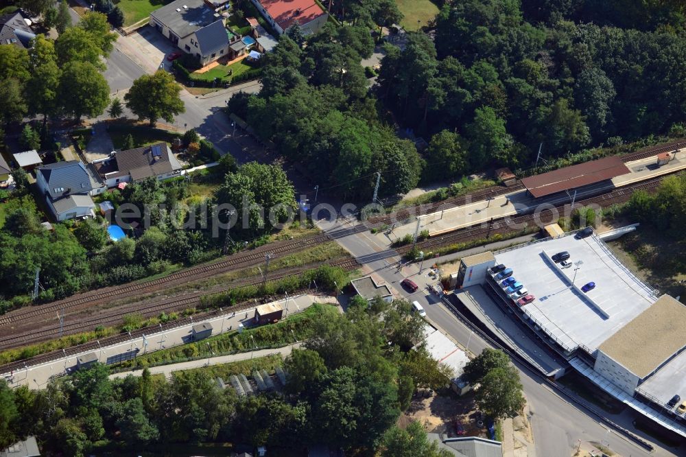 Blankenfelde from the bird's eye view: Road layout of the Karl-Marx-Straße on the railway line Dresdner Bahn to the station Blankenfelde in Brandenburg. By the engineering community Dresdner Bahn is the new construction of a railway bridge as planned bridge construction