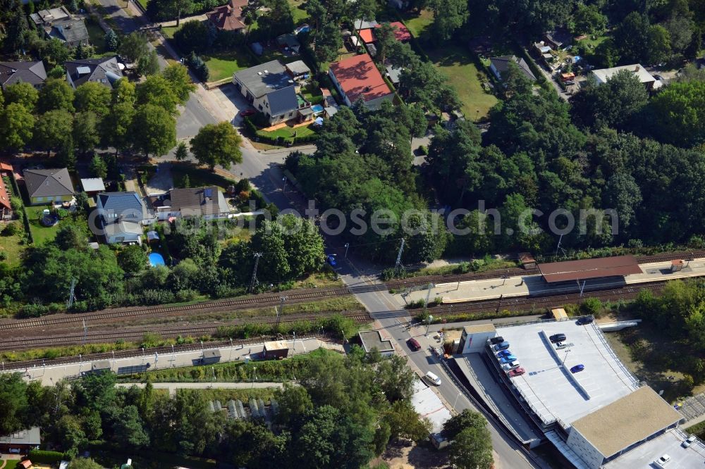 Aerial image Blankenfelde - Road layout of the Karl-Marx-Straße on the railway line Dresdner Bahn to the station Blankenfelde in Brandenburg. By the engineering community Dresdner Bahn is the new construction of a railway bridge as planned bridge construction