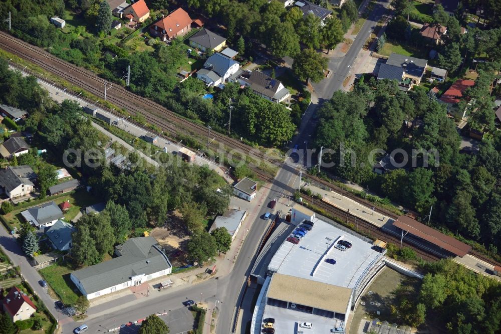 Aerial image Blankenfelde - Road layout of the Karl-Marx-Straße on the railway line Dresdner Bahn to the station Blankenfelde in Brandenburg. By the engineering community Dresdner Bahn is the new construction of a railway bridge as planned bridge construction