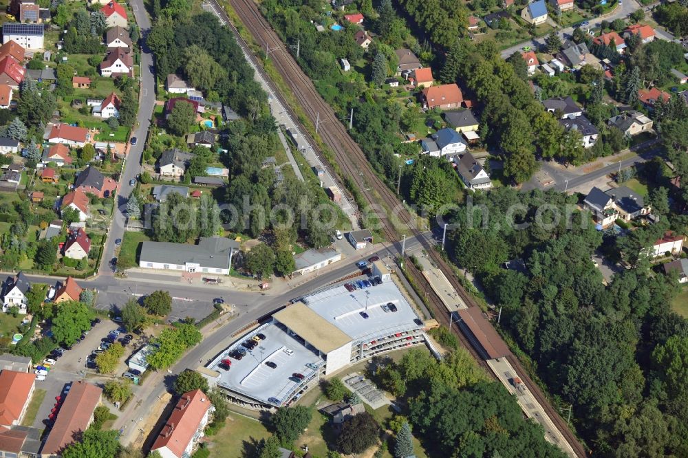 Blankenfelde from the bird's eye view: Road layout of the Karl-Marx-Straße on the railway line Dresdner Bahn to the station Blankenfelde in Brandenburg. By the engineering community Dresdner Bahn is the new construction of a railway bridge as planned bridge construction