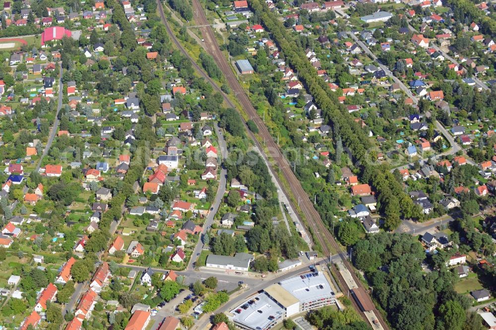 Aerial image Blankenfelde - Road layout of the Karl-Marx-Straße on the railway line Dresdner Bahn to the station Blankenfelde in Brandenburg. By the engineering community Dresdner Bahn is the new construction of a railway bridge as planned bridge construction