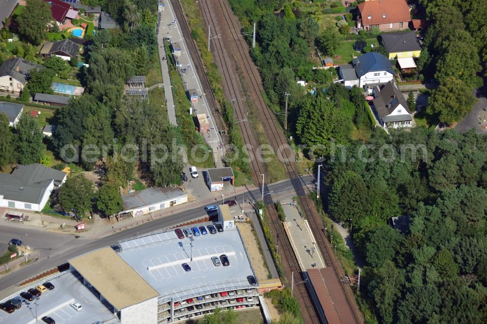 Aerial photograph Blankenfelde - Road layout of the Karl-Marx-Straße on the railway line Dresdner Bahn to the station Blankenfelde in Brandenburg. By the engineering community Dresdner Bahn is the new construction of a railway bridge as planned bridge construction