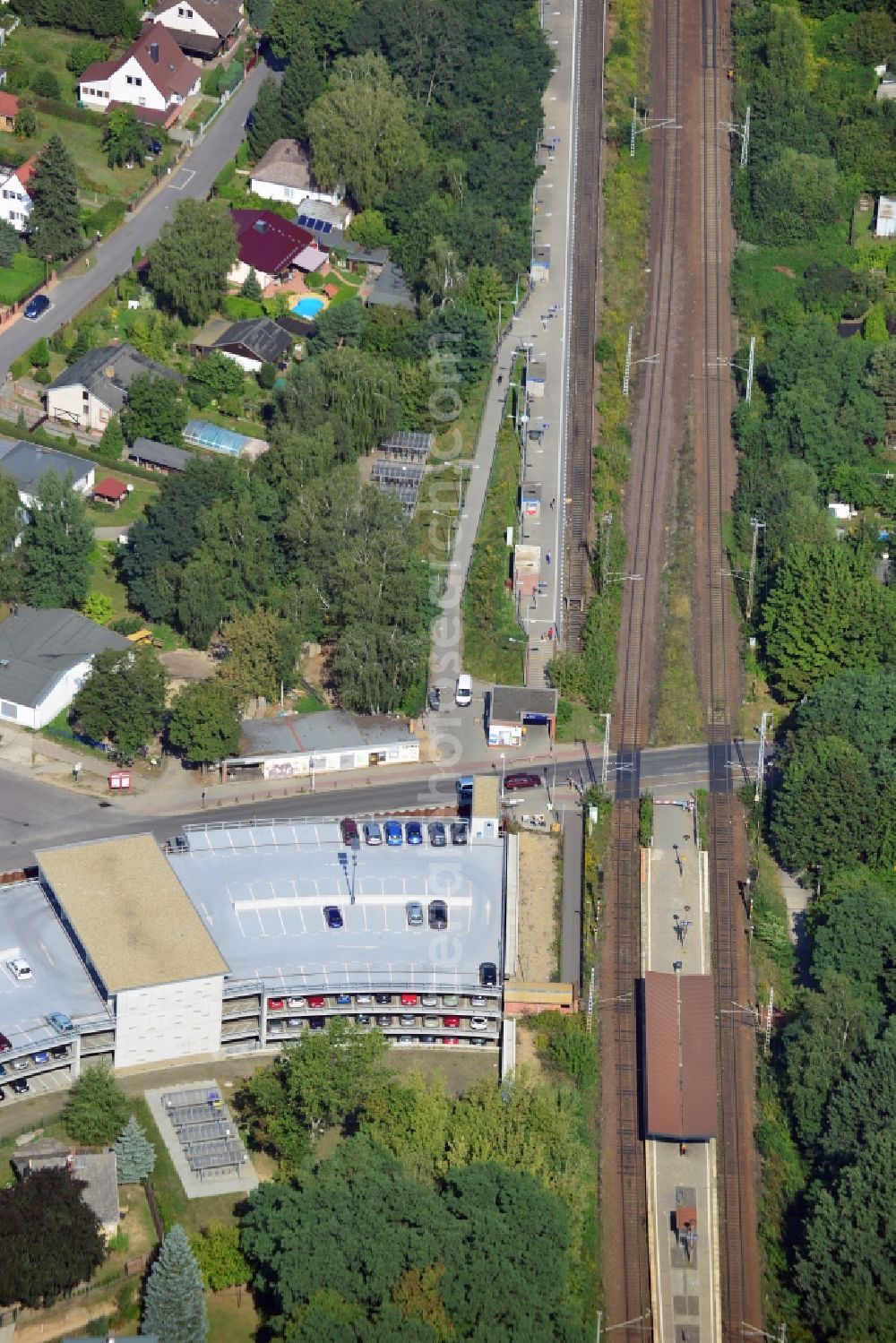 Blankenfelde from above - Road layout of the Karl-Marx-Straße on the railway line Dresdner Bahn to the station Blankenfelde in Brandenburg. By the engineering community Dresdner Bahn is the new construction of a railway bridge as planned bridge construction