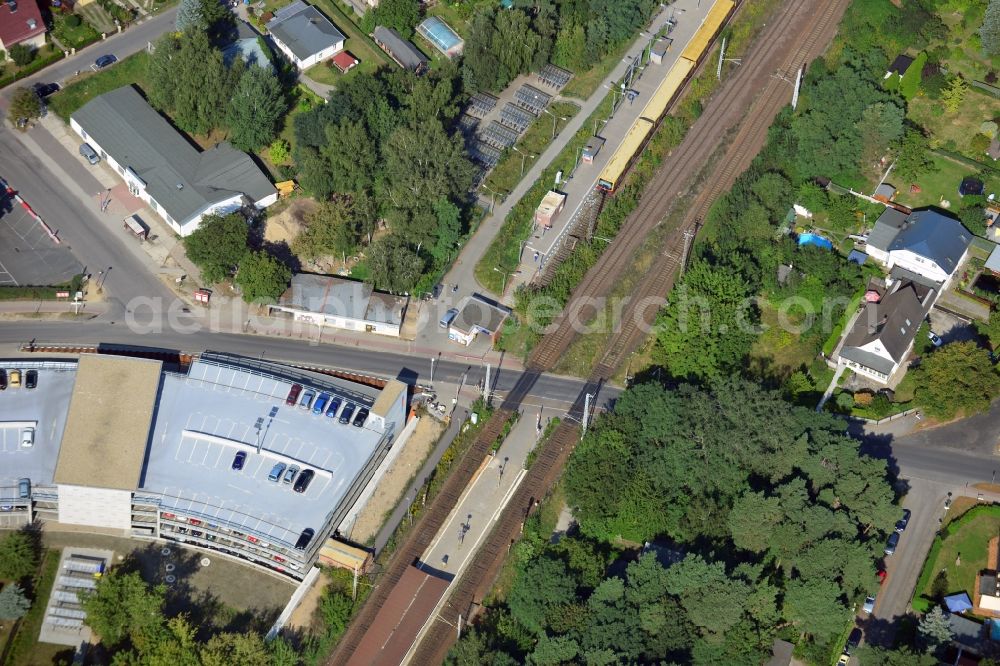 Blankenfelde from the bird's eye view: Road layout of the Karl-Marx-Straße on the railway line Dresdner Bahn to the station Blankenfelde in Brandenburg. By the engineering community Dresdner Bahn is the new construction of a railway bridge as planned bridge construction