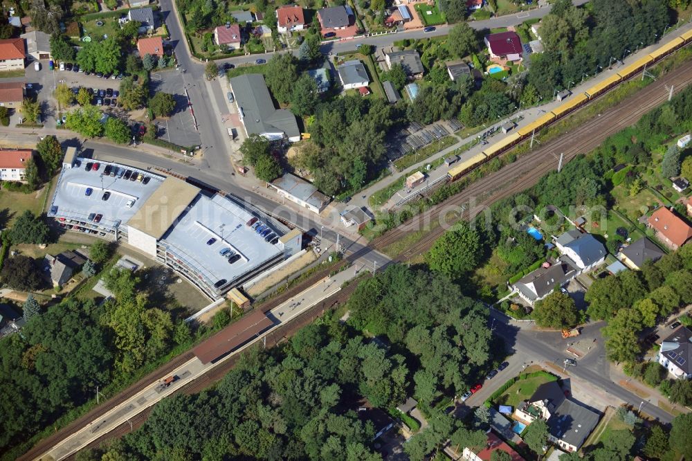 Aerial image Blankenfelde - Road layout of the Karl-Marx-Straße on the railway line Dresdner Bahn to the station Blankenfelde in Brandenburg. By the engineering community Dresdner Bahn is the new construction of a railway bridge as planned bridge construction