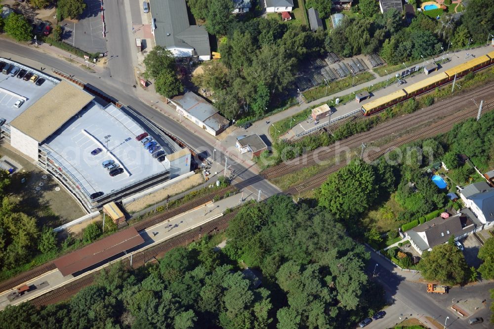 Aerial photograph Blankenfelde - Road layout of the Karl-Marx-Straße on the railway line Dresdner Bahn to the station Blankenfelde in Brandenburg. By the engineering community Dresdner Bahn is the new construction of a railway bridge as planned bridge construction