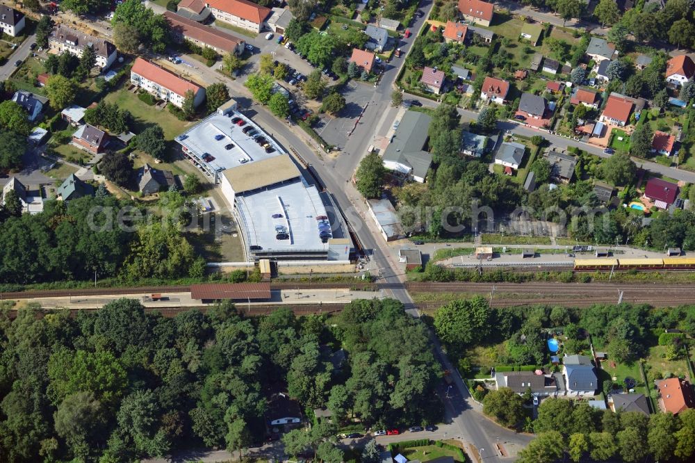 Blankenfelde from above - Road layout of the Karl-Marx-Straße on the railway line Dresdner Bahn to the station Blankenfelde in Brandenburg. By the engineering community Dresdner Bahn is the new construction of a railway bridge as planned bridge construction