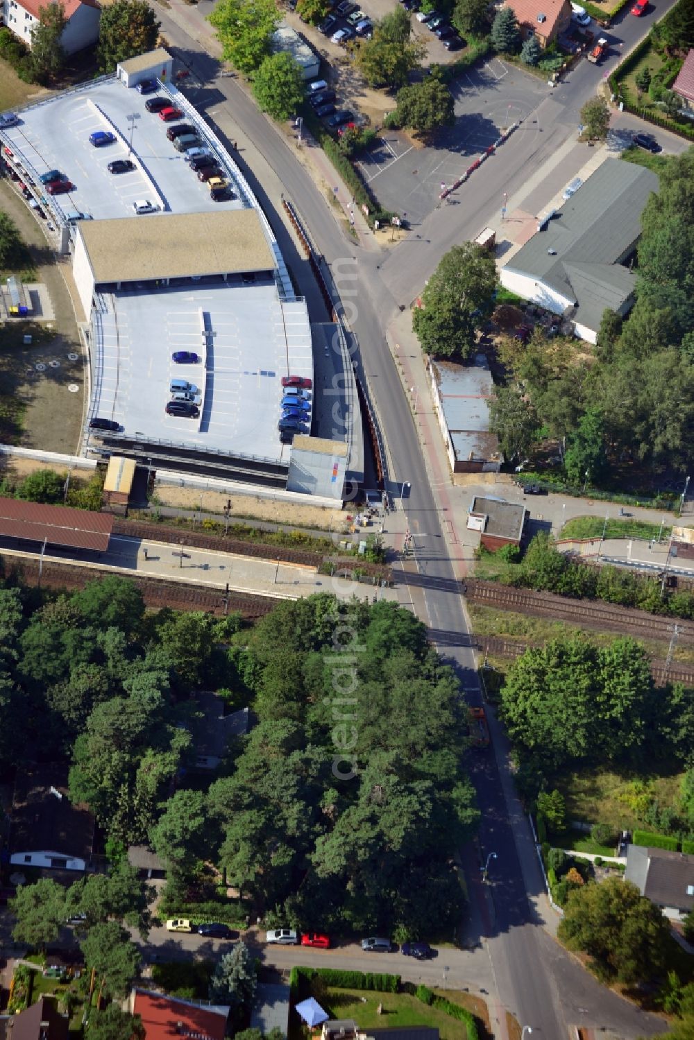 Blankenfelde from the bird's eye view: Road layout of the Karl-Marx-Straße on the railway line Dresdner Bahn to the station Blankenfelde in Brandenburg. By the engineering community Dresdner Bahn is the new construction of a railway bridge as planned bridge construction