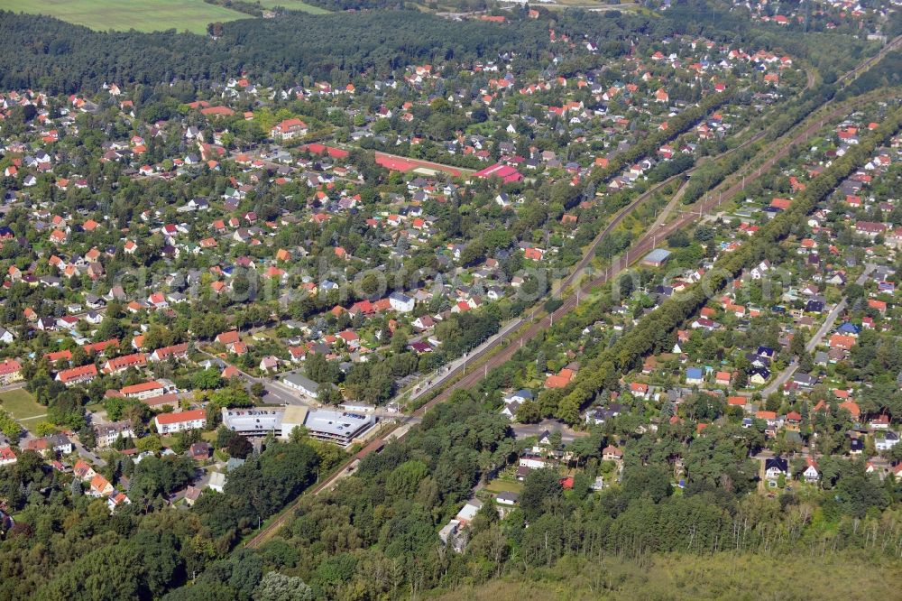 Blankenfelde from the bird's eye view: Road layout of the Karl-Marx-Straße on the railway line Dresdner Bahn to the station Blankenfelde in Brandenburg. By the engineering community Dresdner Bahn is the new construction of a railway bridge as planned bridge construction