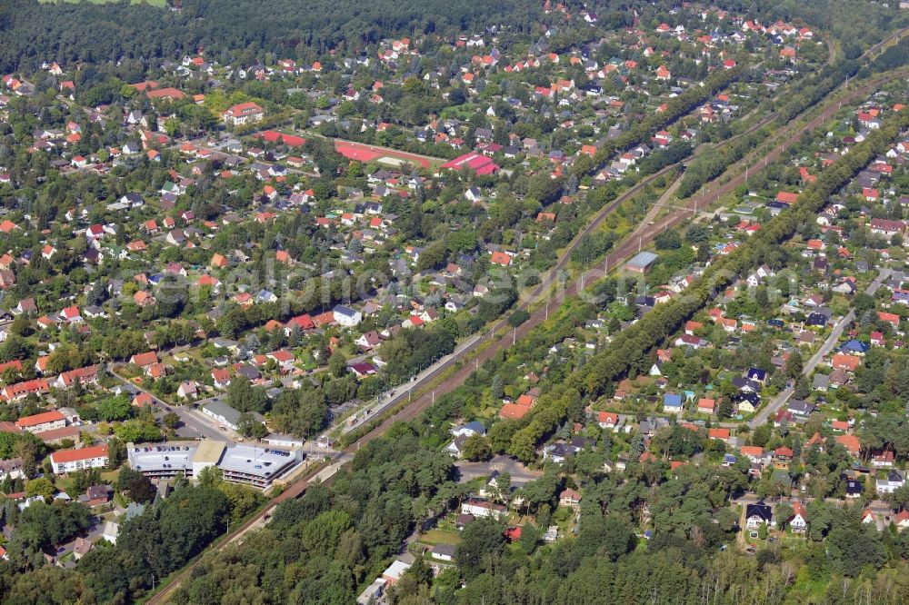 Aerial image Blankenfelde - Road layout of the Karl-Marx-Straße on the railway line Dresdner Bahn to the station Blankenfelde in Brandenburg. By the engineering community Dresdner Bahn is the new construction of a railway bridge as planned bridge construction