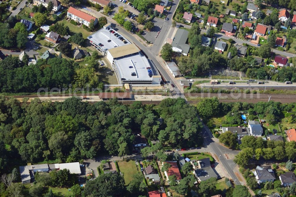 Blankenfelde from above - Road layout of the Karl-Marx-Straße on the railway line Dresdner Bahn to the station Blankenfelde in Brandenburg. By the engineering community Dresdner Bahn is the new construction of a railway bridge as planned bridge construction