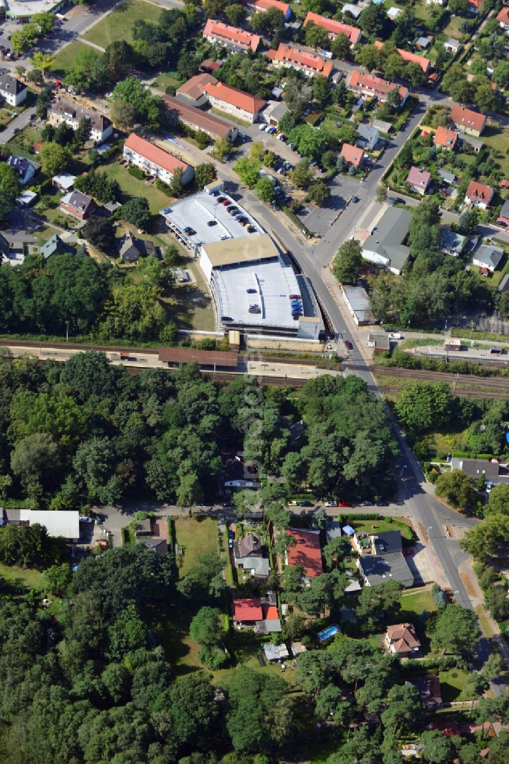 Blankenfelde from the bird's eye view: Road layout of the Karl-Marx-Straße on the railway line Dresdner Bahn to the station Blankenfelde in Brandenburg. By the engineering community Dresdner Bahn is the new construction of a railway bridge as planned bridge construction