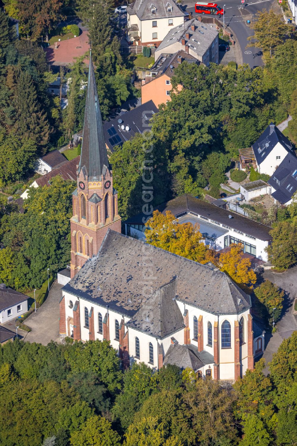 Aerial image Fröndenberg/Ruhr - Church building of the catholic church of the family center in the pastoral network as well as parking lot and train station in Froendenberg/Ruhr in the state North Rhine-Westphalia, Germany