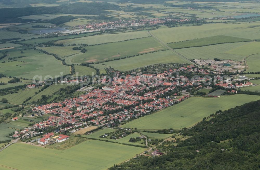 Kelbra (Kyffhäuser) from the bird's eye view: In the northwest of the Kyffhaeuser Mountains in Saxony-Anhalt is the city Kelbra. The city is surrounded by fertile fields of the Goldene Aue. In the city center there are several attractions such as the historic town hall in the Renaissance period, the former monastery church of St. Georgii and remains of the old castle with its donjon. Kelbra is a popular destination