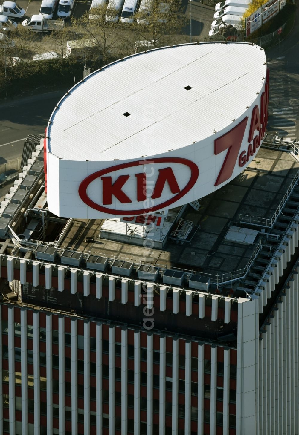 Saint-Denis from the bird's eye view: KIA advertising on the roof of High-rise buildings R.S.I I.D.F Centre (Regime Social des Independants d'Ile de France) am Boulevard Anatole France in Saint-Denis in Ile-de-France, France