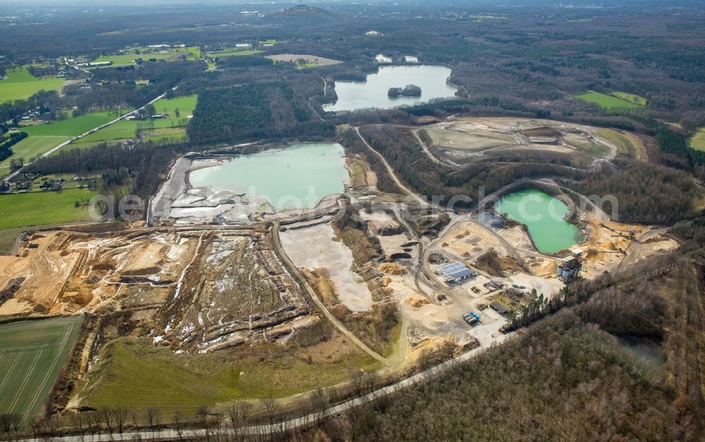 Bottrop from the bird's eye view: Site and tailings area of the gravel and sand mine of Lore Spickermann GmbH & Co. KG in Kirchhellen in the state of North Rhine-Westphalia