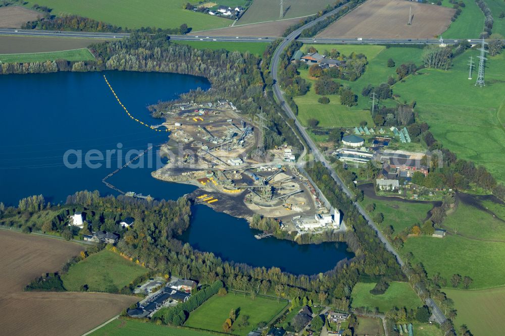 Aerial photograph Neukirchen-Vluyn - Terrain and waste areas of the gravel and sand opencast mine on Krefelder Strasse in Neukirchen-Vluyn in the state of North Rhine-Westphalia, Germany