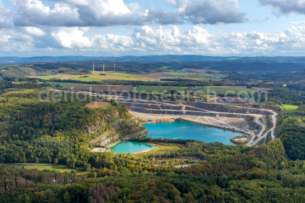 Balve from the bird's eye view: Site and tailings area of the gravel mining ond flooded gravel pit in Balve in the state North Rhine-Westphalia, Germany